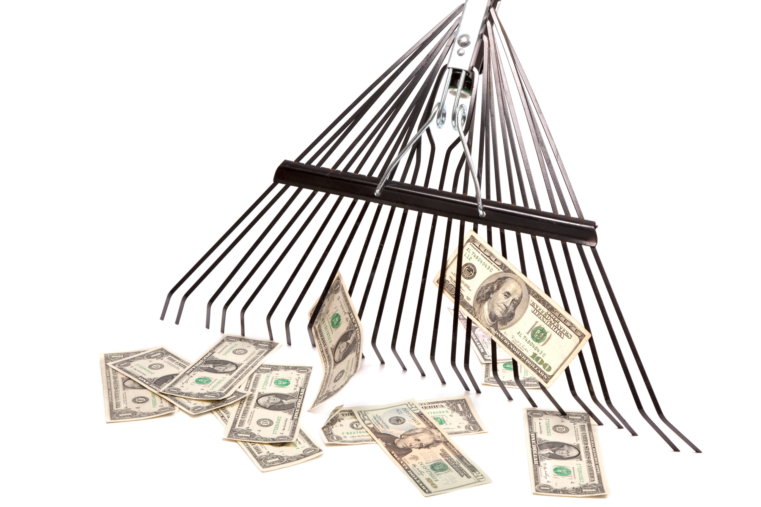 A rake is seen attempting to scrape back a few dollars, illustrating a story about the development of collective licensing in the UK for AI applications.